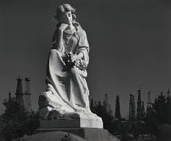 Cemetery Statue and Oil Derricks, Long Beach, California