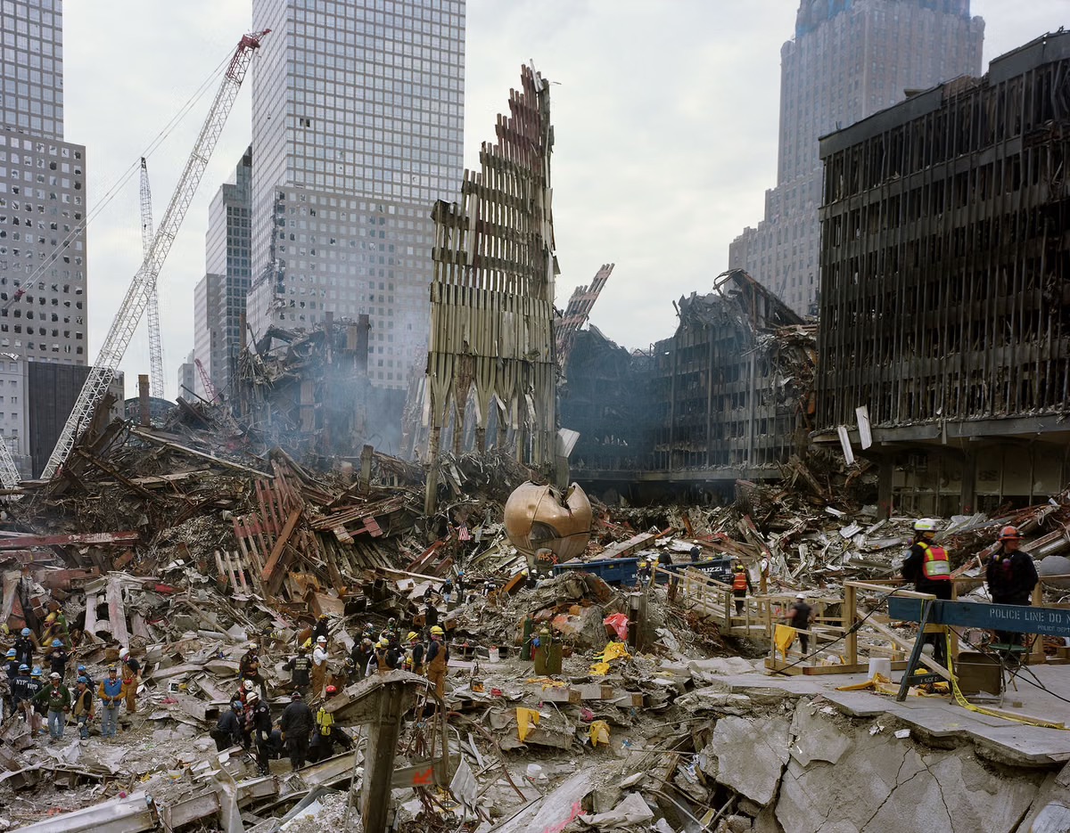 The cleared World Trade Center site with a standing section of facade